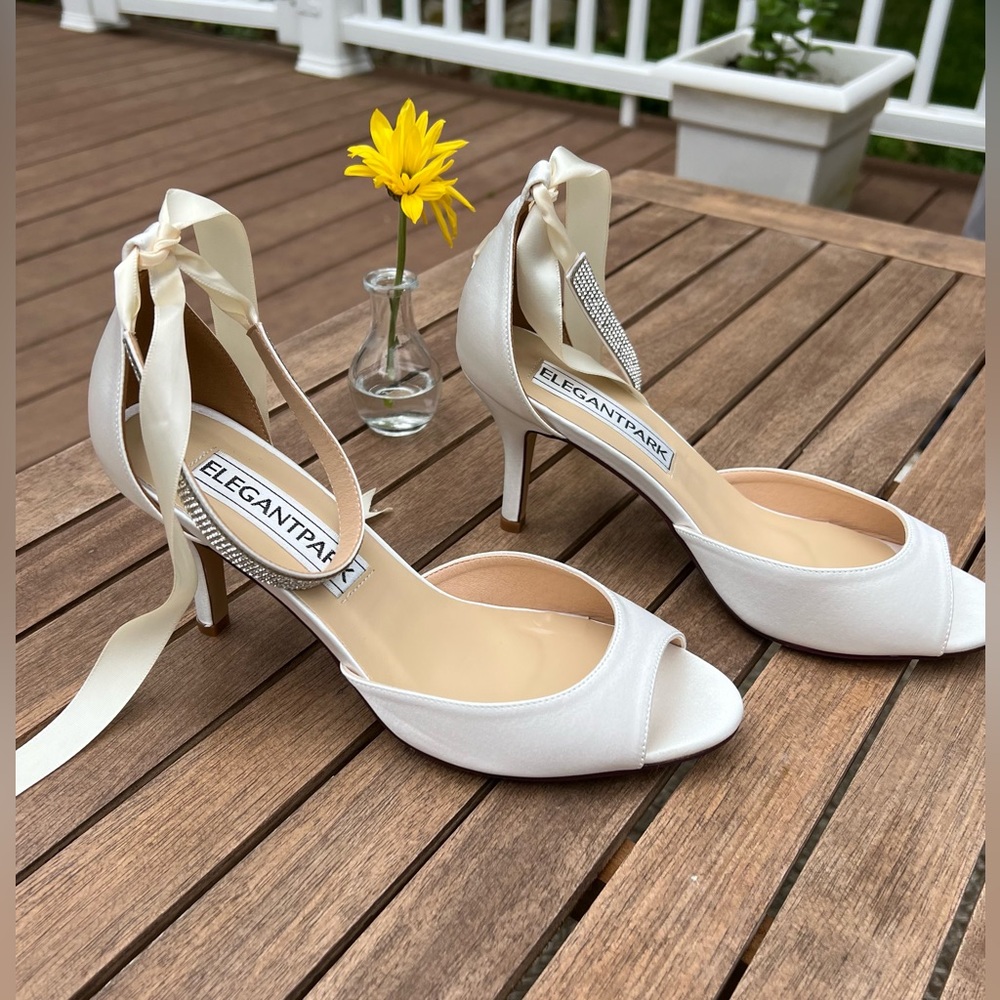 New never worn ivory heels with 2 types of ankle strap. Size 8.5